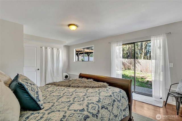 791 NE Pinecrest Dr, Bremerton, WA 98311 - bedroom with access to exterior and wood finished floors