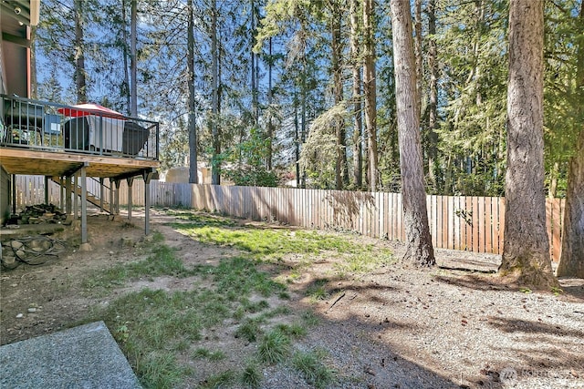 791 NE Pinecrest Dr, Bremerton, WA 98311 - view of yard with stairway, a deck, and fence