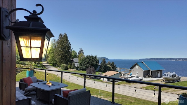 34A Saratoga Dr, Hat Island, WA 98206 - balcony with a water view and an outdoor fire pit