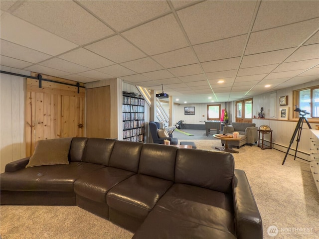 34A Saratoga Dr, Hat Island, WA 98206 - living area with carpet floors, wood walls, and a drop ceiling