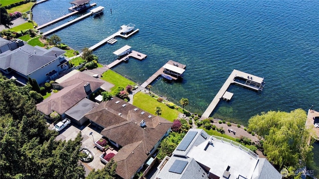 birds eye view of property with a water view and a residential view