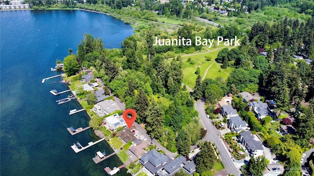 drone / aerial view featuring a residential view and a water view