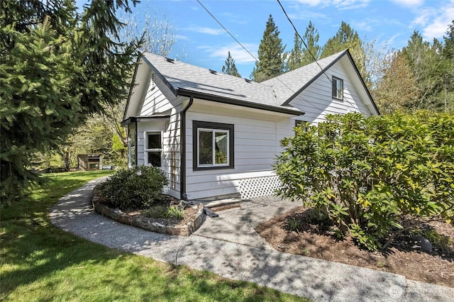 view of property exterior featuring roof with shingles