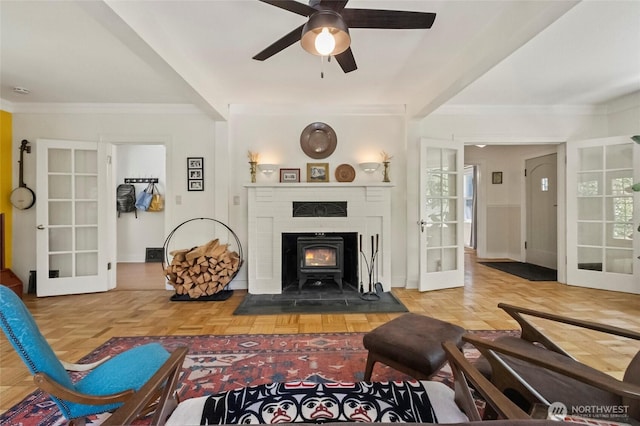 living area featuring ornamental molding, french doors, and ceiling fan