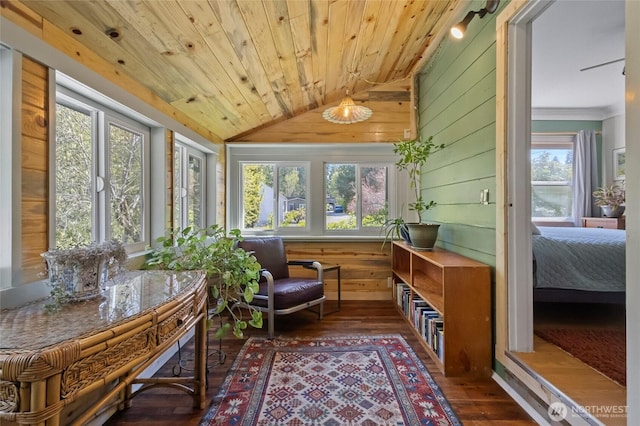 sunroom featuring wood ceiling, vaulted ceiling, a wealth of natural light, and hardwood / wood-style flooring