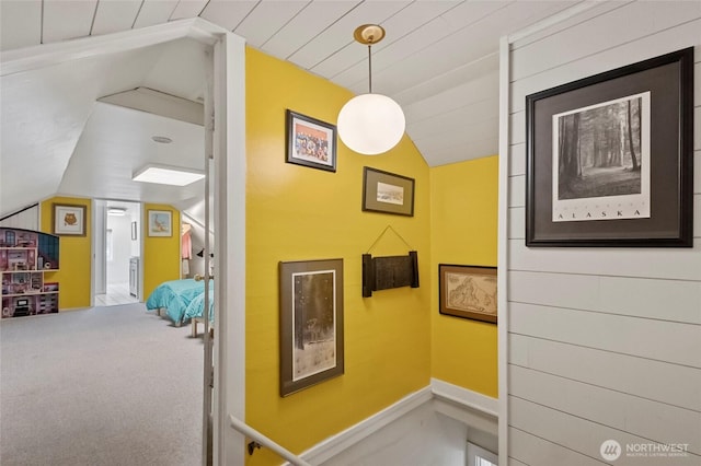hallway featuring vaulted ceiling