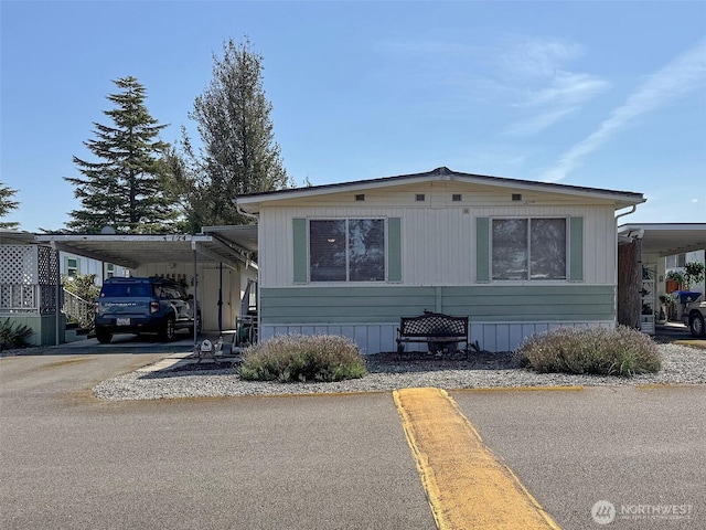 610 W Spruce Unit 124, Sequim, WA 98382 - manufactured / mobile home with a carport and driveway
