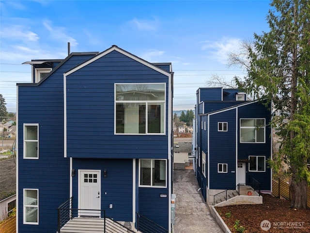 9751 57th Ave S, Seattle, WA 98118 - view of front of property featuring fence and entry steps