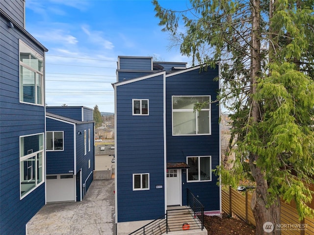 9751 57th Ave S, Seattle, WA 98118 - contemporary home featuring fence