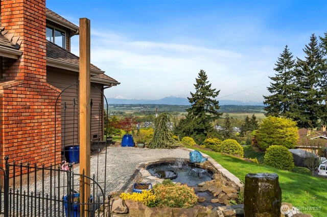view of patio with a garden pond