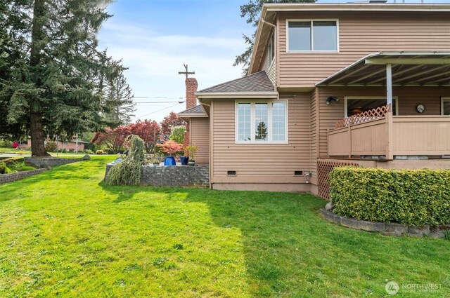 back of house featuring a yard