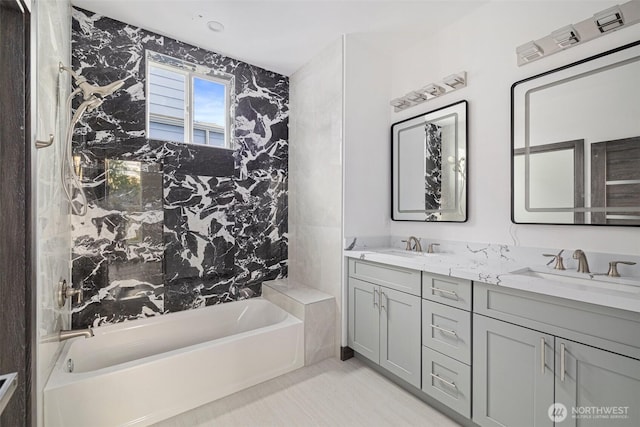 bathroom featuring double vanity, a sink, and a tub