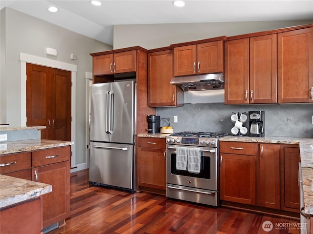 17111 NE 5th St, Bellevue, WA 98008 - kitchen featuring appliances with stainless steel finishes, lofted ceiling, under cabinet range hood, dark wood-style flooring, and brown cabinets