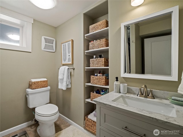 17111 NE 5th St, Bellevue, WA 98008 - bathroom featuring baseboards, toilet, vanity, and tile patterned flooring