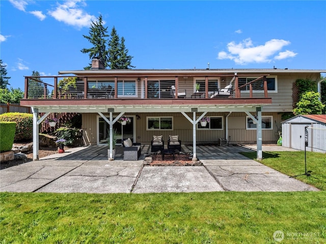 17111 NE 5th St, Bellevue, WA 98008 - back of property with a patio area, a chimney, a yard, and a wooden deck