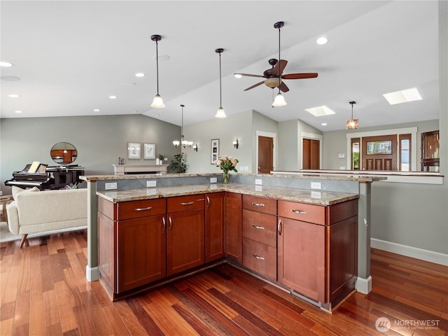 17111 NE 5th St, Bellevue, WA 98008 - kitchen with open floor plan, lofted ceiling, a skylight, dark wood finished floors, and ceiling fan