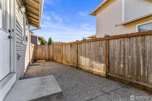 view of yard with a fenced backyard and a patio area