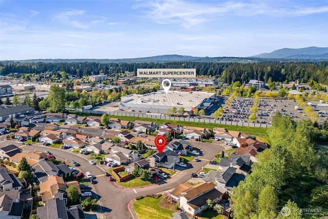 aerial view with a forest view and a mountain view