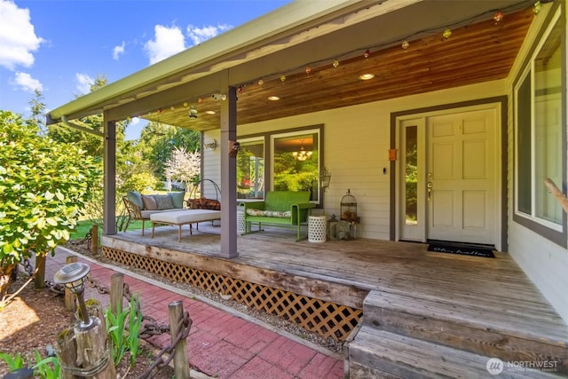 wooden deck featuring covered porch