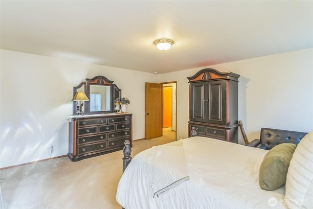 bedroom with baseboards and carpet flooring