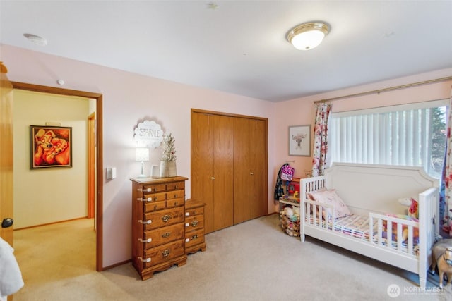 bedroom with carpet floors and a closet