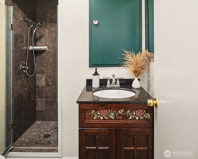 full bathroom featuring vanity and a stall shower