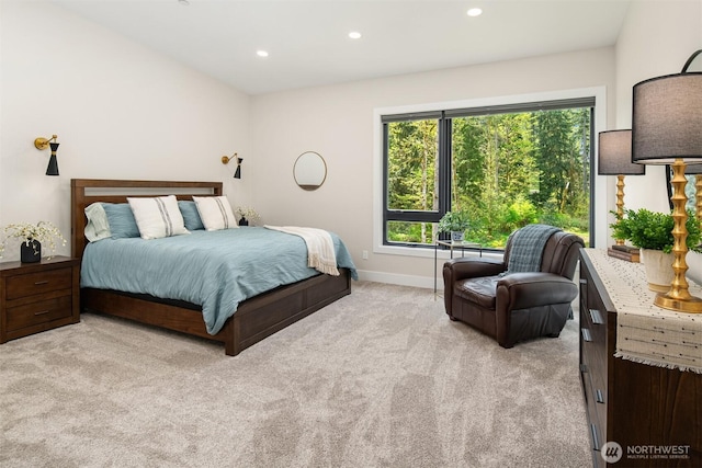 bedroom featuring baseboards, light carpet, and recessed lighting