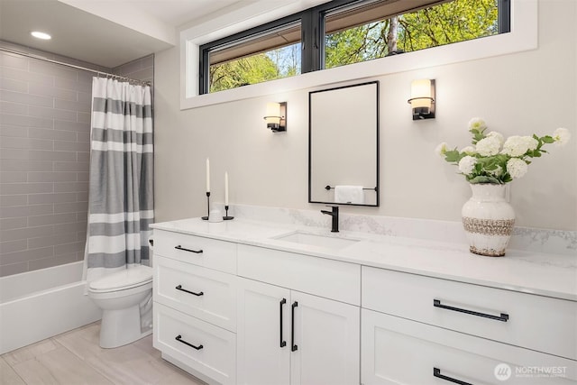 bathroom with vanity, recessed lighting, shower / tub combo, and toilet