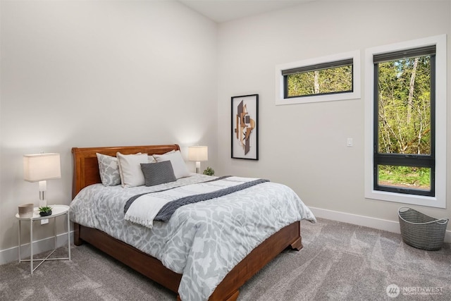 bedroom featuring carpet floors and baseboards