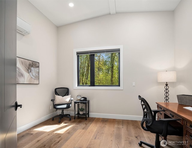 office space with an AC wall unit, recessed lighting, baseboards, wood finished floors, and lofted ceiling