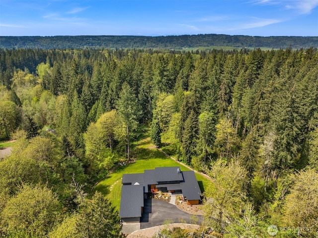 aerial view featuring a forest view