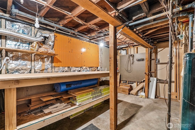 unfinished basement featuring a workshop area