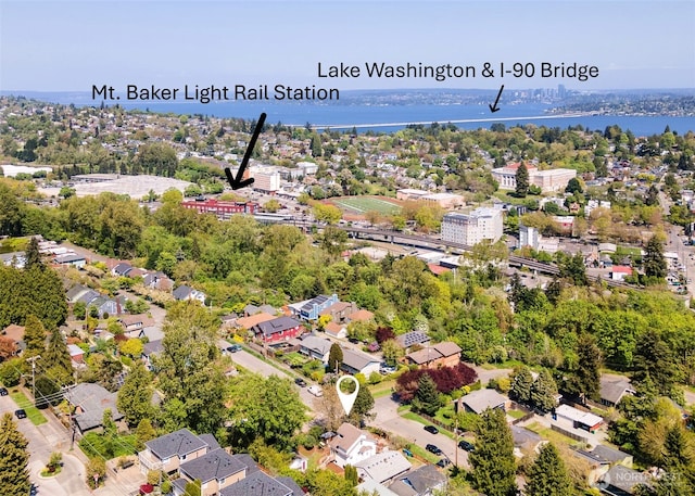 bird's eye view featuring a residential view and a water view