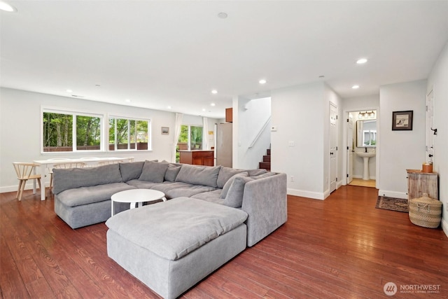 living area with plenty of natural light, recessed lighting, and wood finished floors