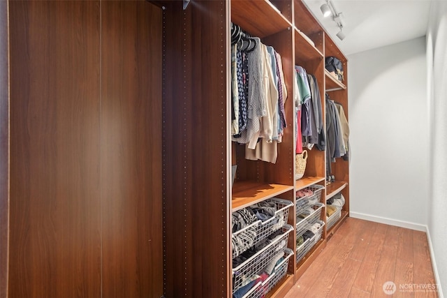 spacious closet with light wood-style floors