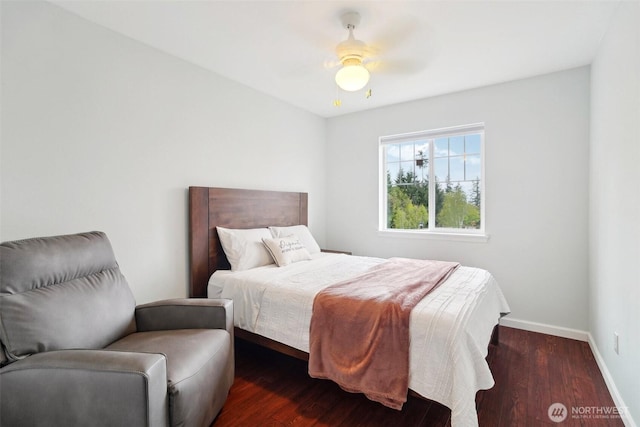 bedroom featuring baseboards, ceiling fan, and wood finished floors