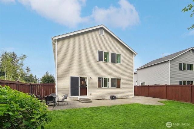 rear view of property with a patio, a yard, and entry steps