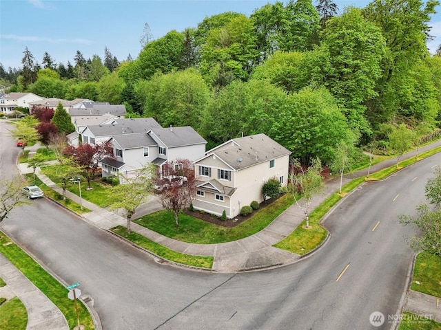 birds eye view of property with a residential view