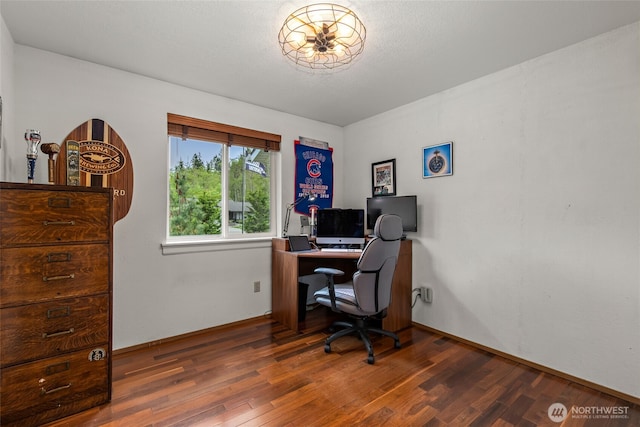 home office featuring baseboards and wood finished floors