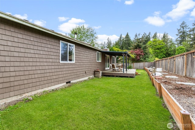 view of yard with a fenced backyard and a wooden deck
