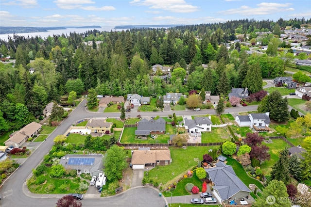 aerial view featuring a residential view and a forest view
