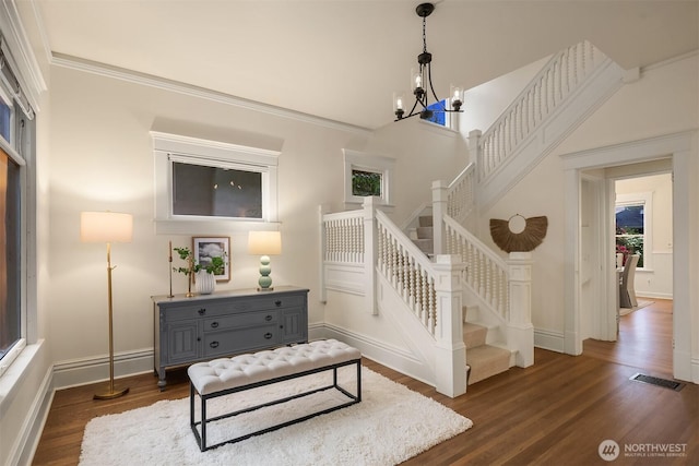 stairway featuring wood finished floors and baseboards