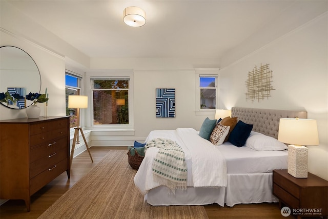 bedroom with wood finished floors