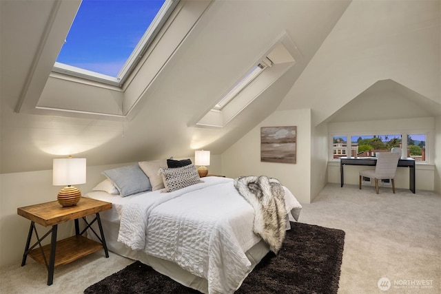 bedroom with a skylight, carpet flooring, and vaulted ceiling