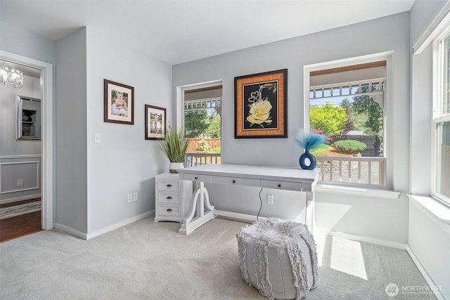 carpeted office space with baseboards