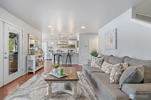 living area with recessed lighting and dark wood finished floors