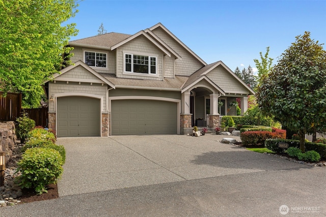 16653 SE 69th Way, Bellevue, WA 98006 - craftsman inspired home with stone siding, an attached garage, concrete driveway, and fence