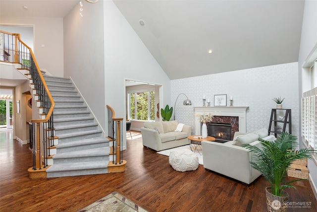 16653 SE 69th Way, Bellevue, WA 98006 - living room with wood finished floors, plenty of natural light, stairs, baseboards, and high vaulted ceiling