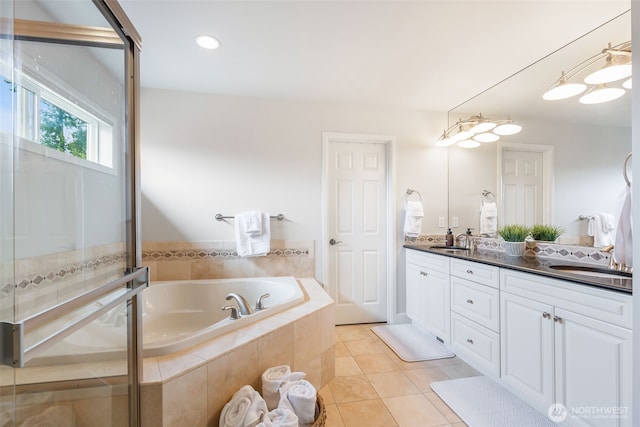 16653 SE 69th Way, Bellevue, WA 98006 - bathroom featuring double vanity, a bath, tile patterned flooring, a shower with shower door, and recessed lighting
