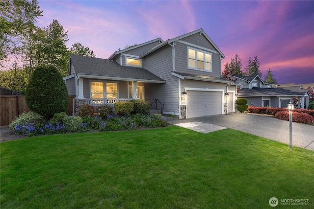 710 122nd Avenue Ct E, Edgewood, WA 98372 - traditional-style home with an attached garage, a front lawn, stone siding, concrete driveway, and covered porch
